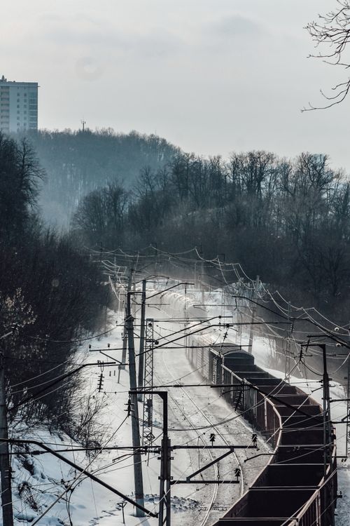 Free Aerial shot of train tracks and cargo in snowy winter landscape at Ufa, Russia. Stock Photo