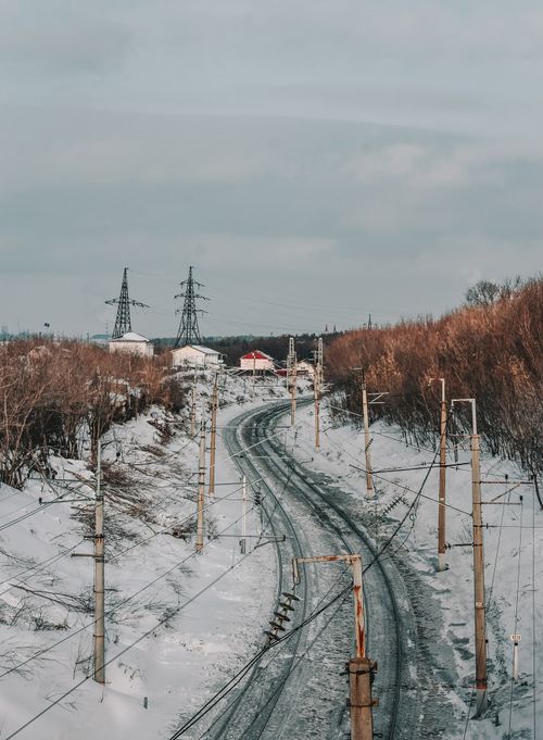Free Scenic winter railway with snow, power lines, and trees in Ufa, Russia. Stock Photo