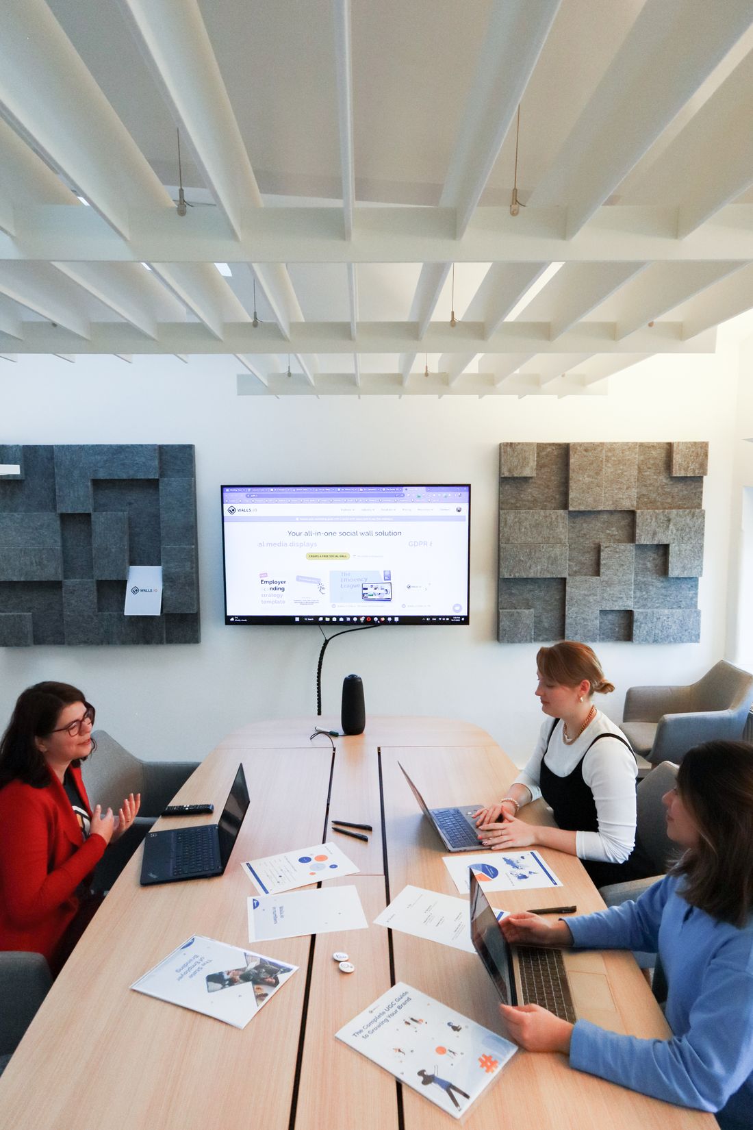 Women working together around a screen