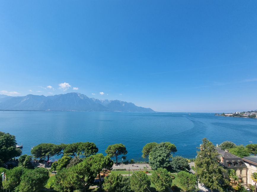 People swimming and enjoying the warm waters of Lake Geneva, Switzerland in summer