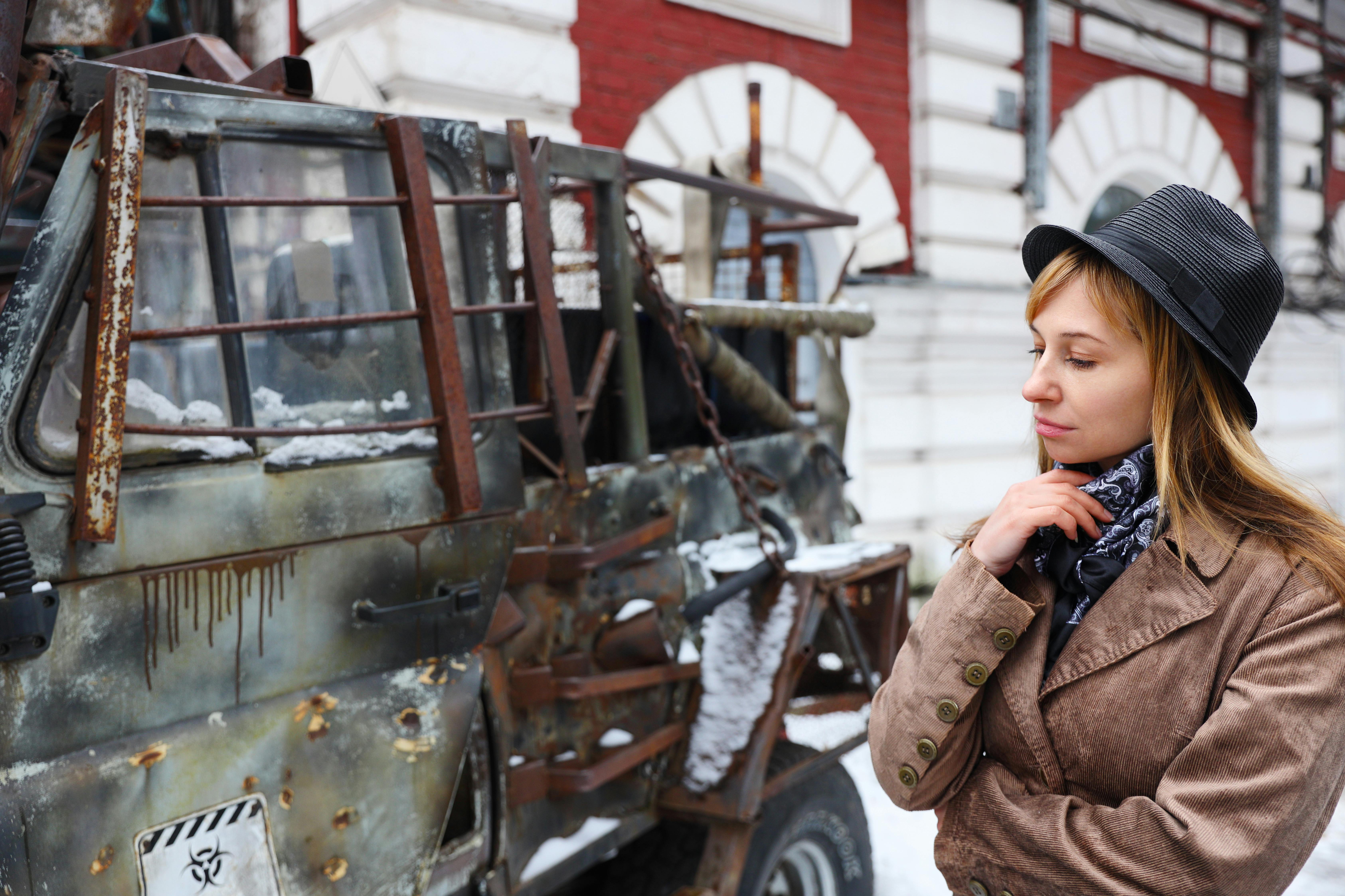 woman looking at vehicke wreck