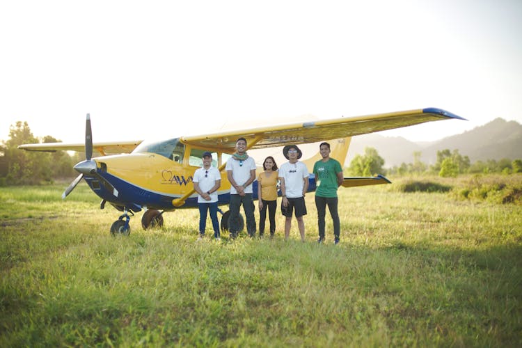 Group Of People By Aircraft