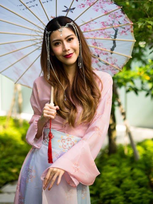 Smiling Woman Posing with Umbrella