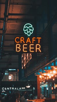 Neon craft beer sign inside an urban bar setting, perfect for nightlife themes.