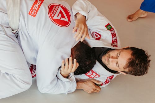 Men Fighting in Martial Arts Competition