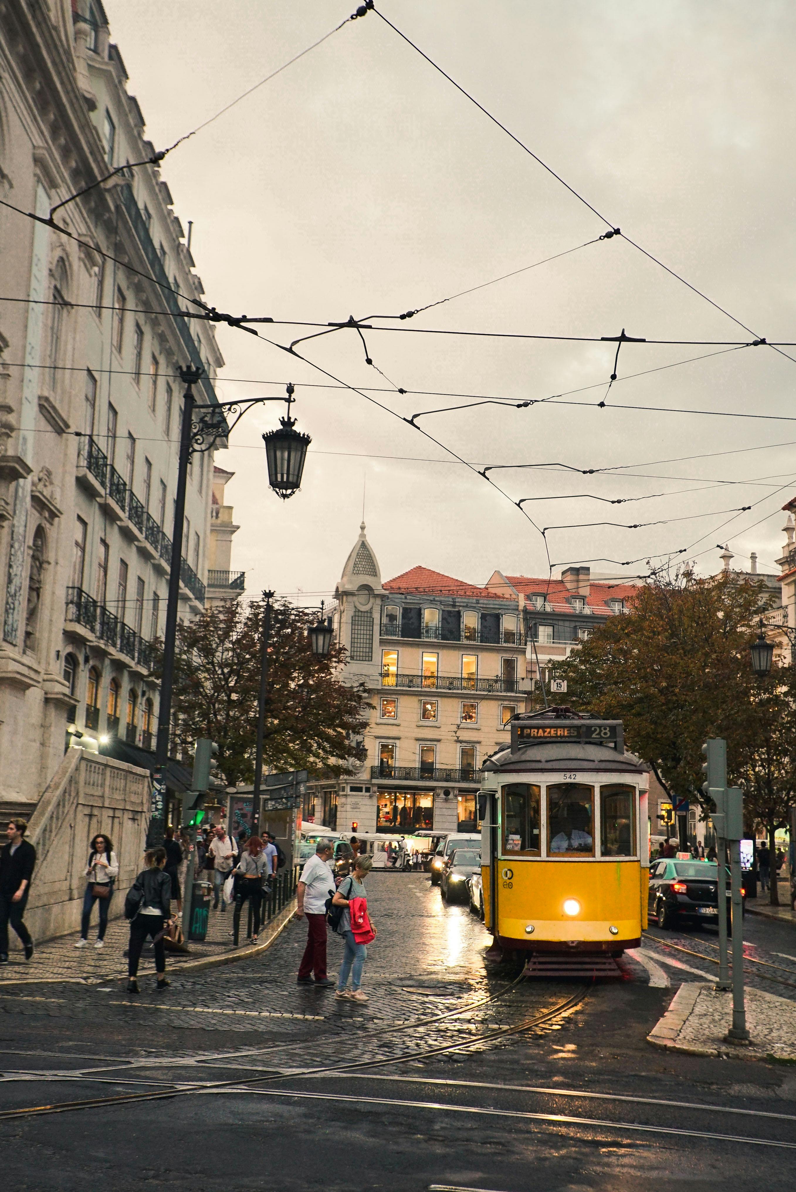 yellow tram in city street