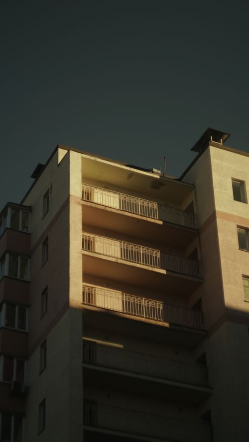 Free A sunlit residential building with balconies in Kyiv, Ukraine, under clear skies. Stock Photo