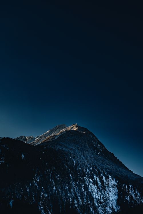 Free Breathtaking view of snow-covered mountains in Mayrhofen, Tyrol, at twilight. Stock Photo