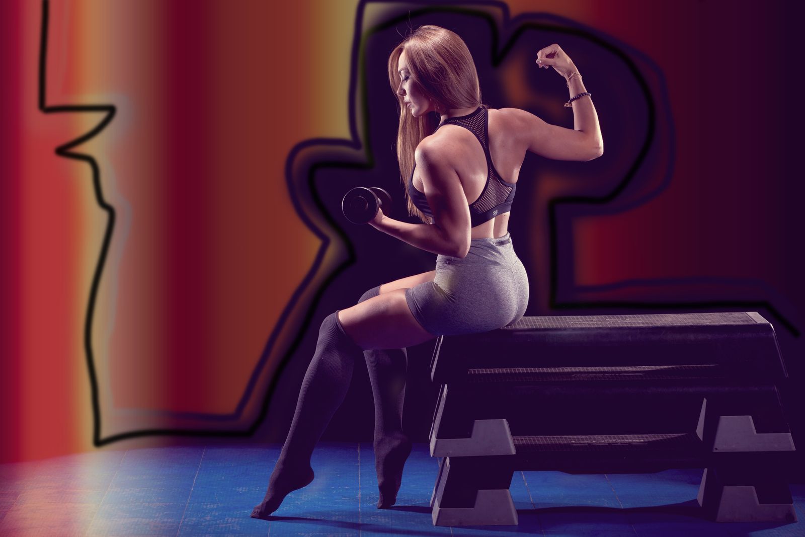 Fit woman with toned physique showcasing results of consistent dance workouts