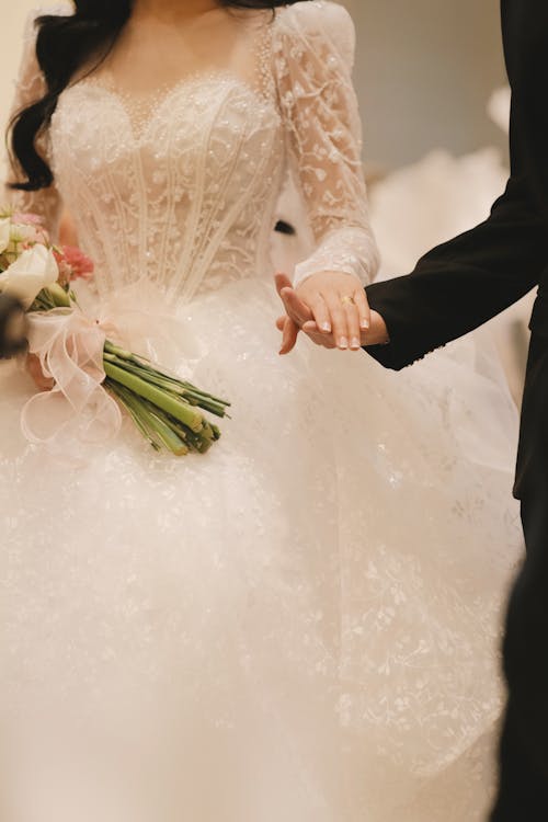 Bride and Groom Holding Hands 