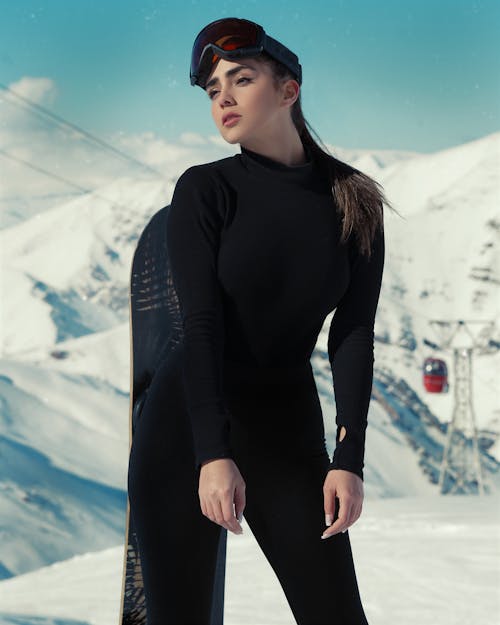 Woman Posing on a Ski Slope 