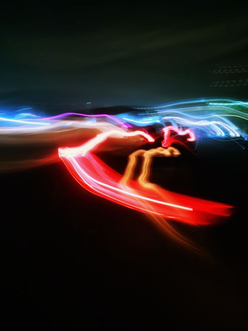 Free Ethereal light trails creating abstract patterns in vivid colors captured during night time. Stock Photo
