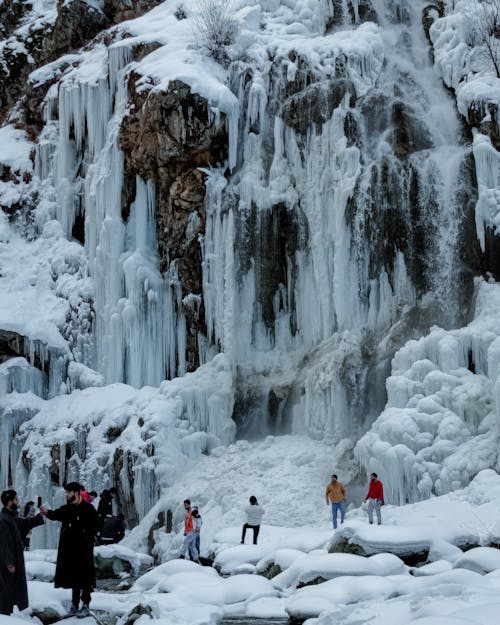 Rock Formation Covered in Snow and Icicles 