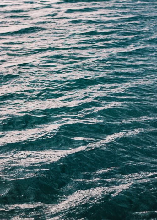 Free Calm and wavy ocean surface captured in natural lighting, highlighting blue tones. Stock Photo