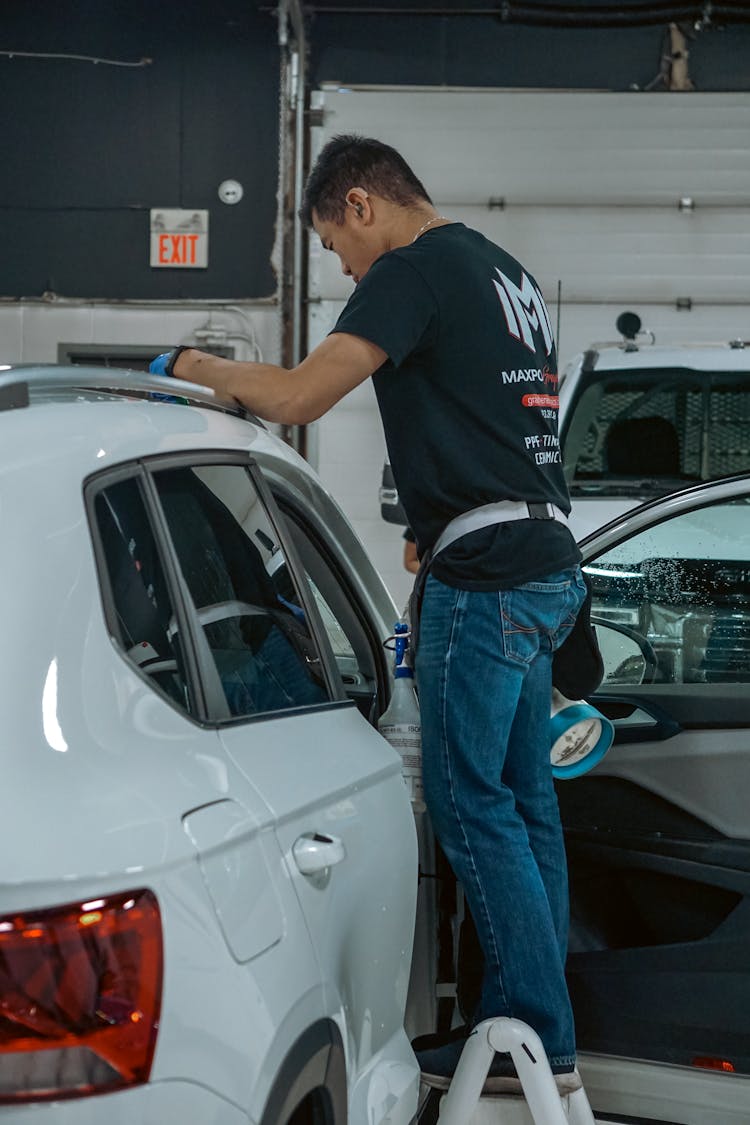 Mechanic Standing Near Car