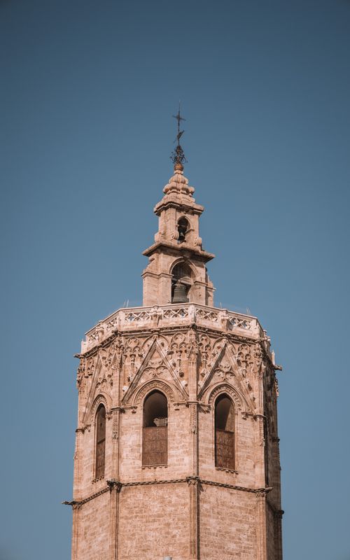 Free A close-up of the historic Miguelete Tower, a landmark in Gothic architecture, located in Valencia, Spain. Stock Photo