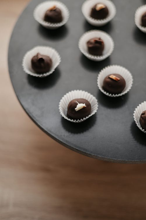 Free Chocolate Praline on a Black Plate Stock Photo
