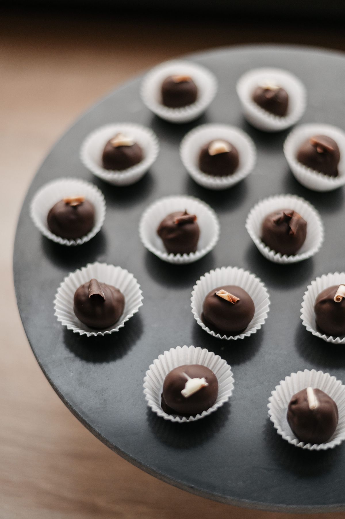 Chocolate pralines on a dark plate