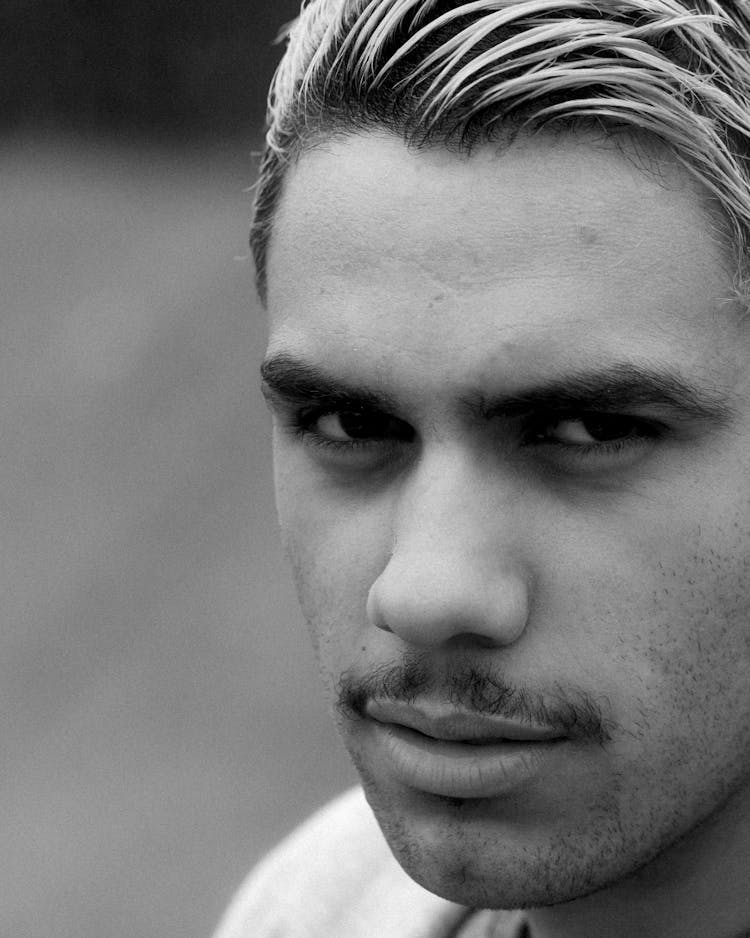 Black And White Photo Of A Confident Mans Face