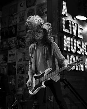 Energetic guitarist performing on stage during a live concert in Orlando, Florida.