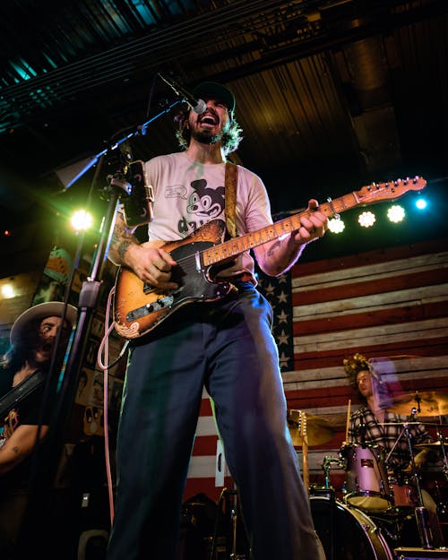 A Rock Band Playing at a Concert 