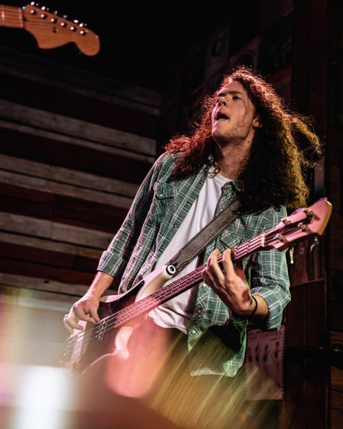 Free Exciting photo of a guitarist rocking the stage during a live music performance in Orlando, FL. Stock Photo