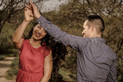 Young Couple Dancing in a Park 
