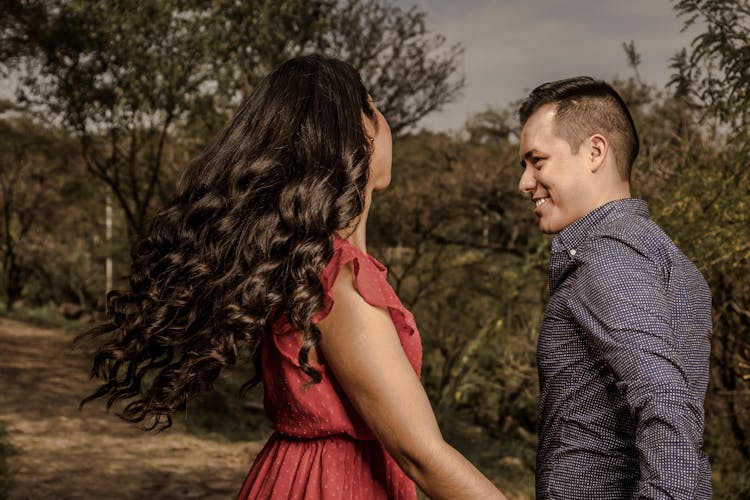 Young Couple Walking In A Park 