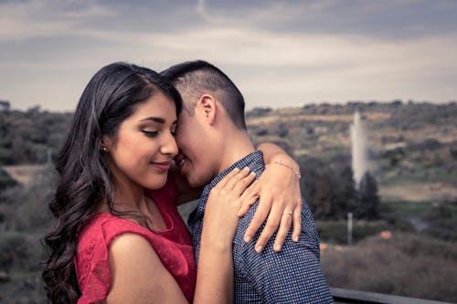 Young Couple Hugging Outdoors 