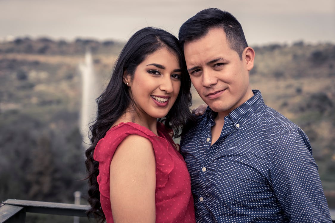 Young Couple Standing Close and Smiling 