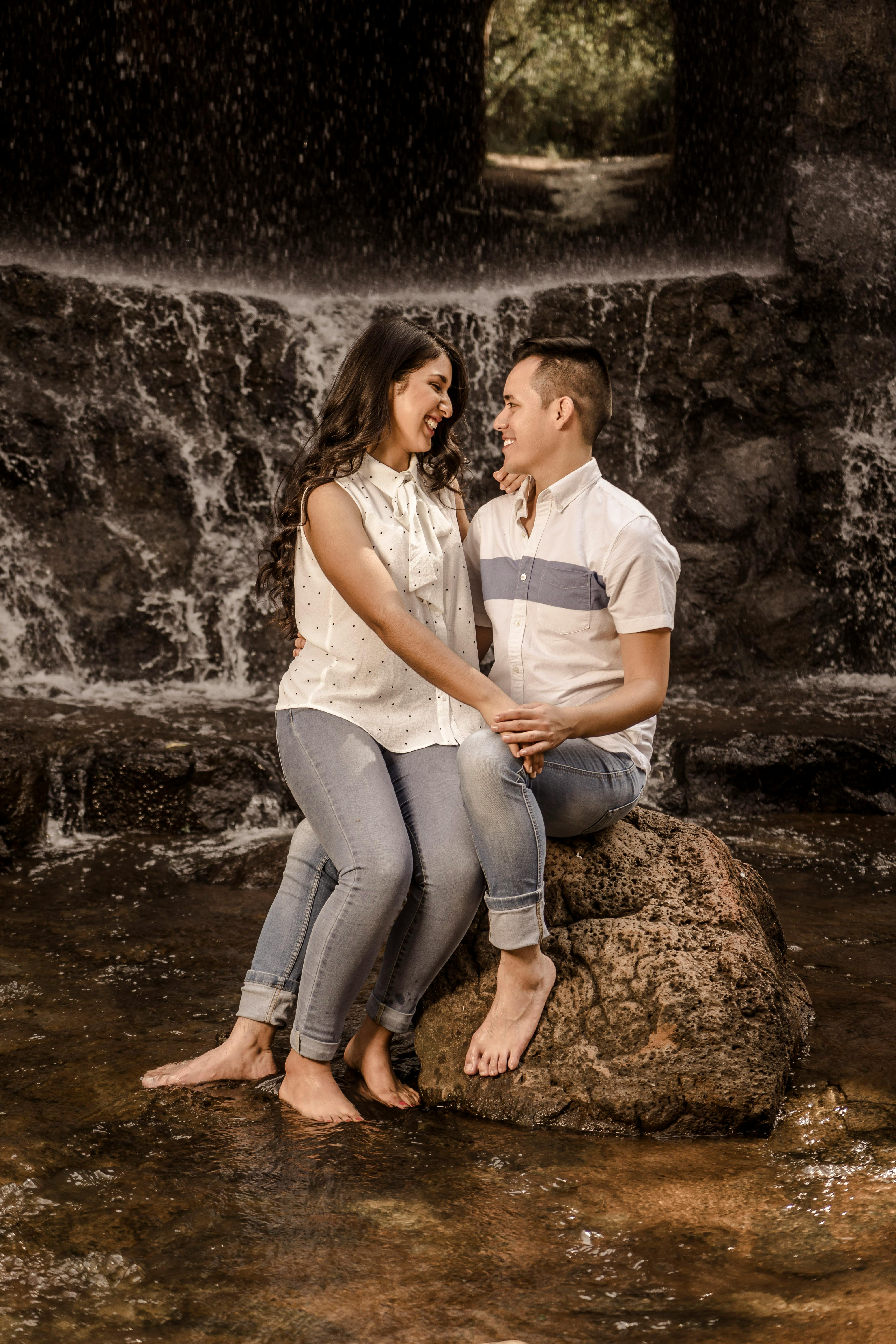 Lexica - A beautiful young age couple in the photography studio posing to  the photographer, sitting on the ground