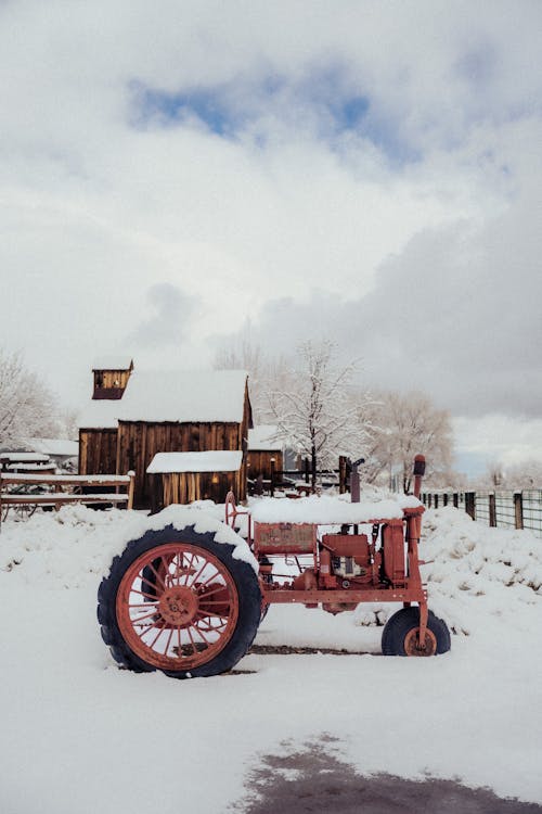 Snow on Tractor on Farm in Winter