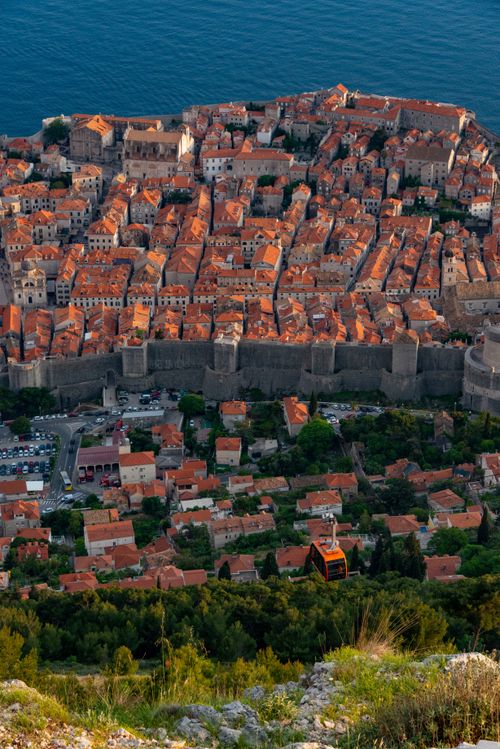 Free Stunning aerial photograph of Dubrovnik's Old Town with terracotta rooftops and fortifications. Stock Photo