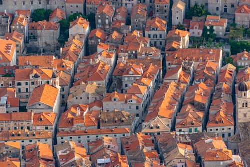 Free Stunning aerial capture of Dubrovnik's iconic red-roofed medieval architecture in summer. Stock Photo