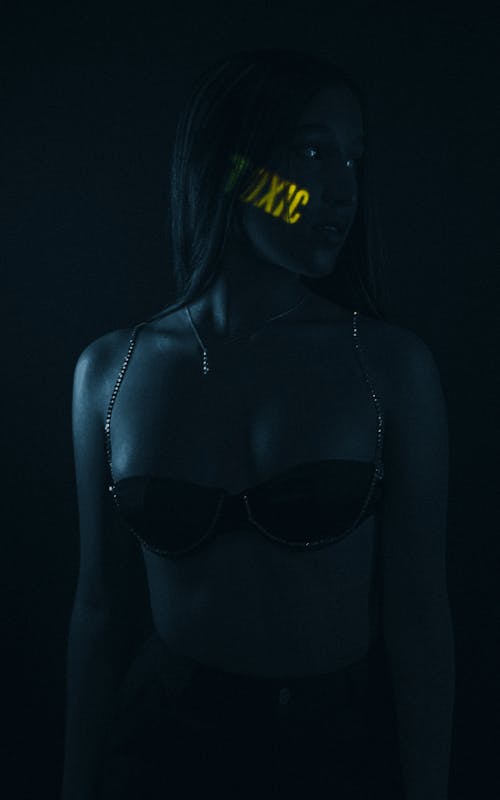 Woman Wearing Underwear Standing in Dark
