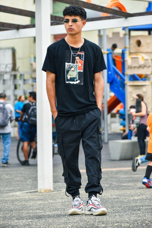 Free Young man in stylish streetwear with sunglasses at playground. Stock Photo