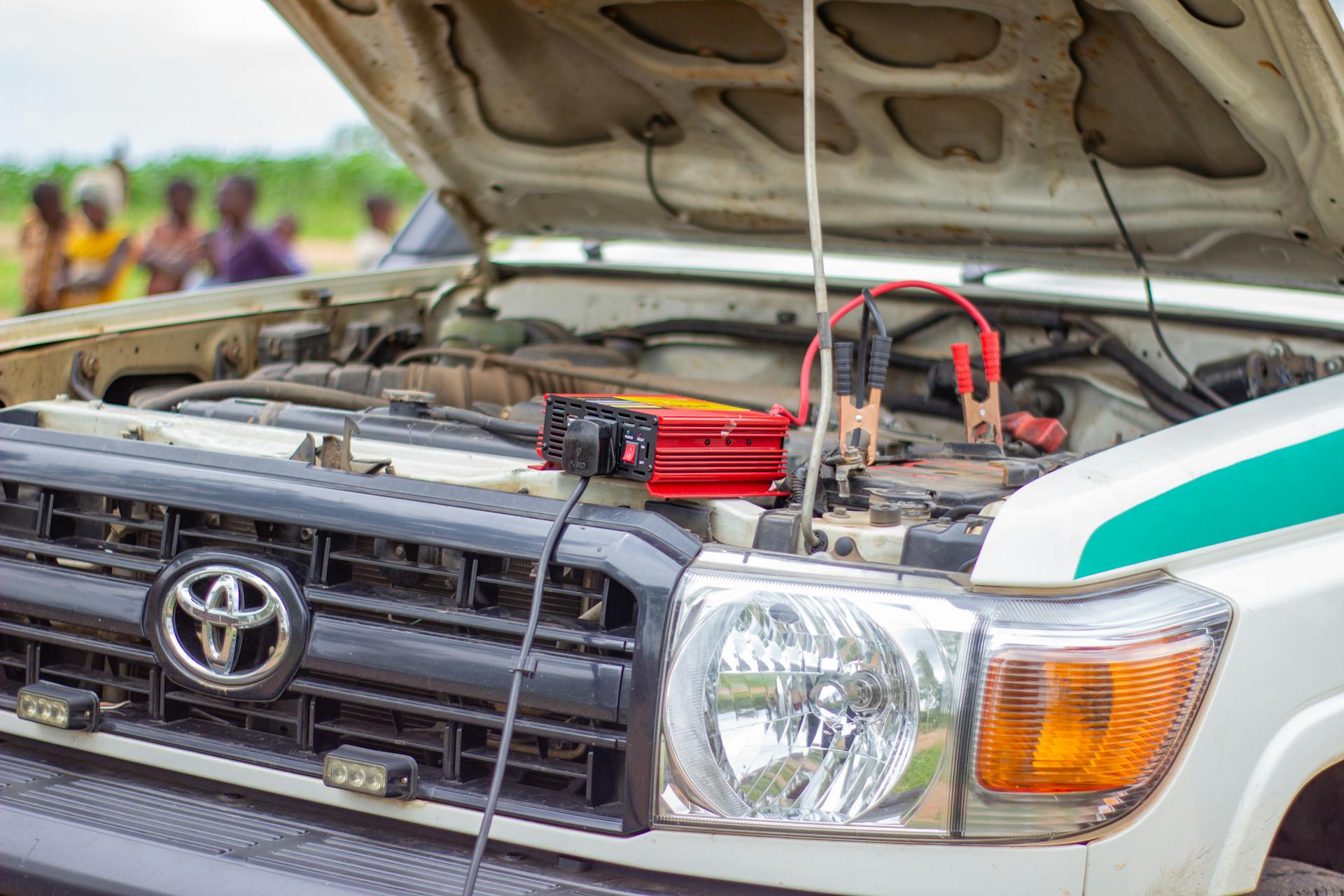 Close-up of car engine with battery charger in Blantyre, Southern Region, Malawi.