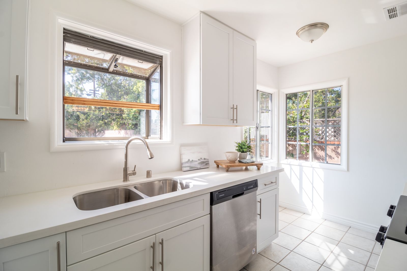 Modern kitchen with stainless steel dishwasher for dishwasher service in The Meadows Dubai