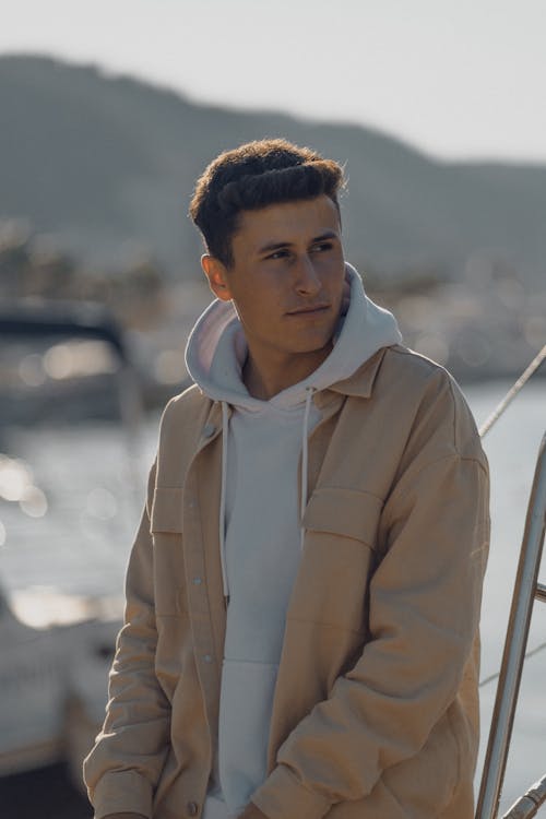 Young Man in a Hoodie and a Jacket 