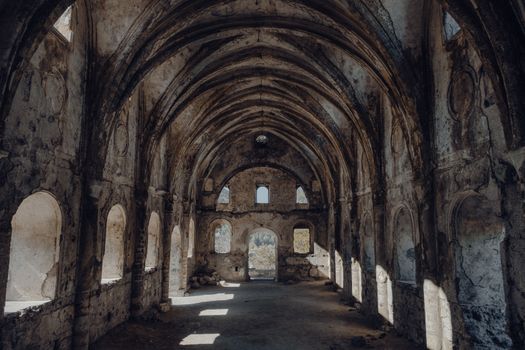 Explore the serene interior of an abandoned Ottoman structure with stunning arched architecture.