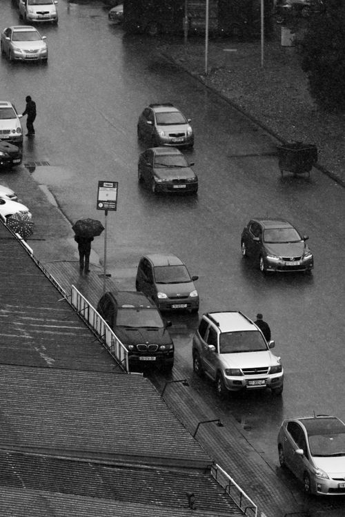 View of Cars and Pedestrians on the Street in Rain · Free Stock Photo