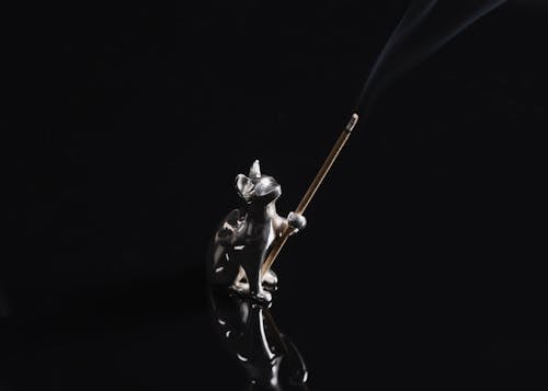 Close-up of a Silver Incense Stick Holder in a Shape of a Cat
