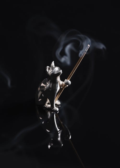 Close-up of a Silver Incense Stick Holder in a Shape of a Cat