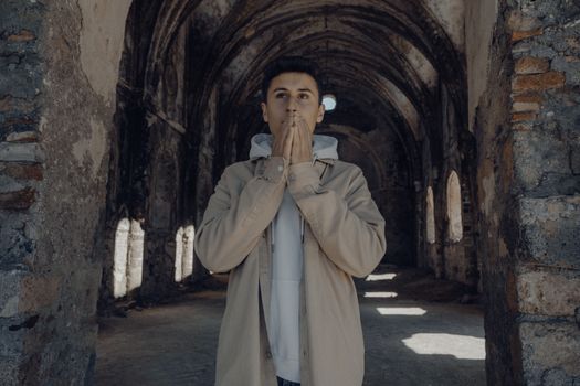 Man Standing in an Abandoned Church 