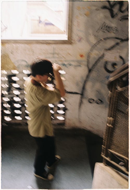 Blurry Picture of a Man on a Staircase with Graffiti 