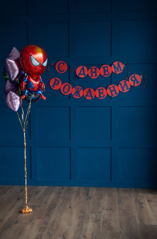 Free A Bunch of Balloons Tied to a Toy Car in a Room Prepared for a Childs Birthday Party Stock Photo