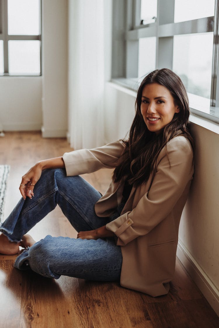 Beautiful Woman Sitting On The Floor 