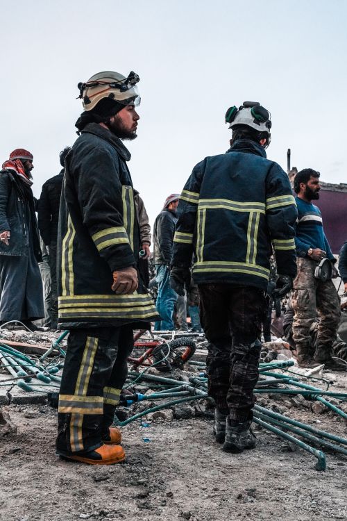 Disaster Stranded People People Standing in a City after a Natural Disaster · Free Stock Photo