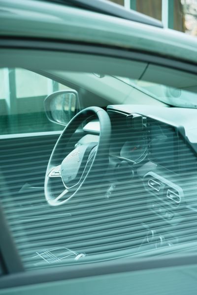 Car dashboard viewed through tinted window