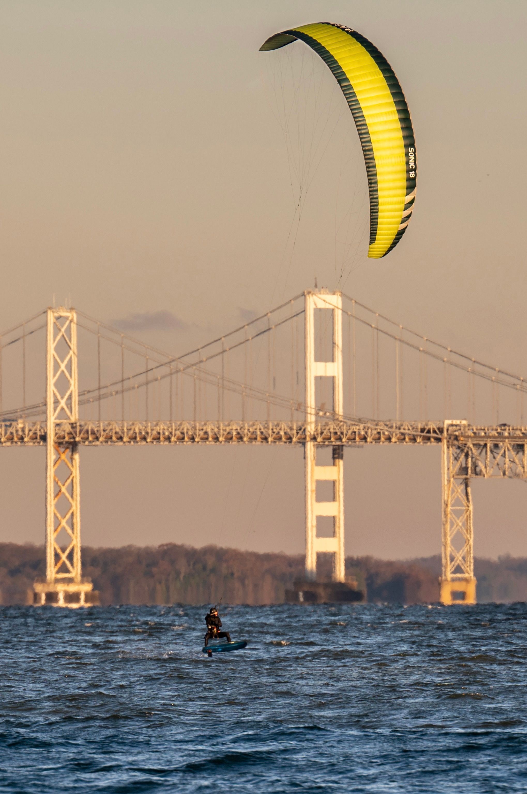 Kitesurfing near Bridge · Free Stock Photo